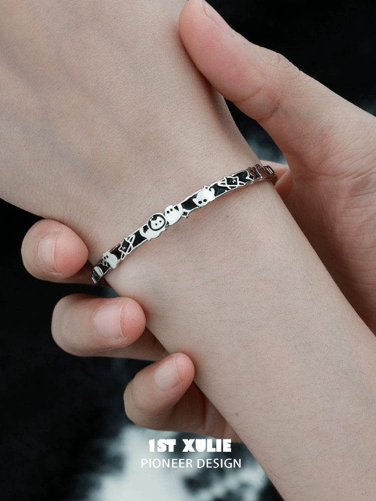 Y2K cat family silver bracelet displayed on a wrist with playful cat designs
