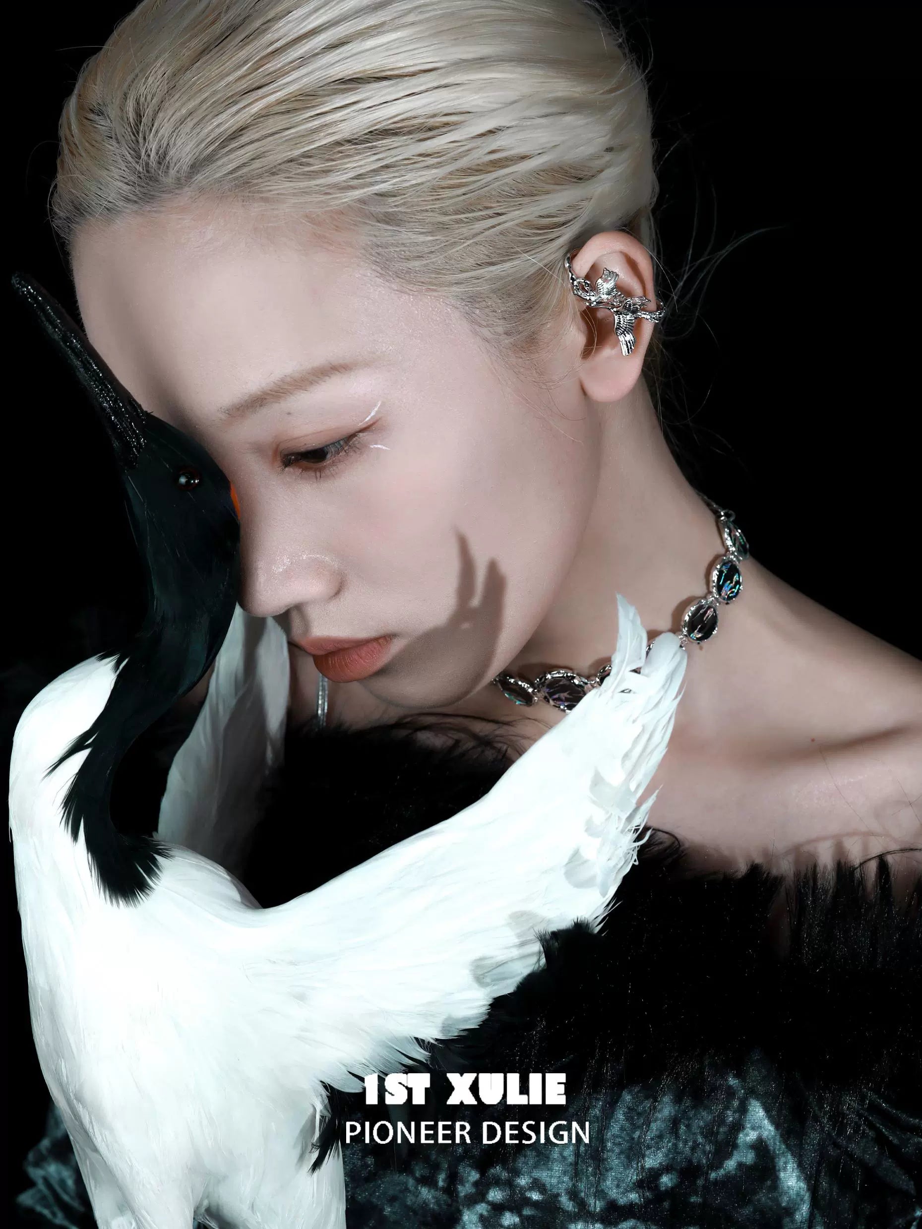 Y2K crane earrings displayed on model with striking hairstyle and unique fashion accessories