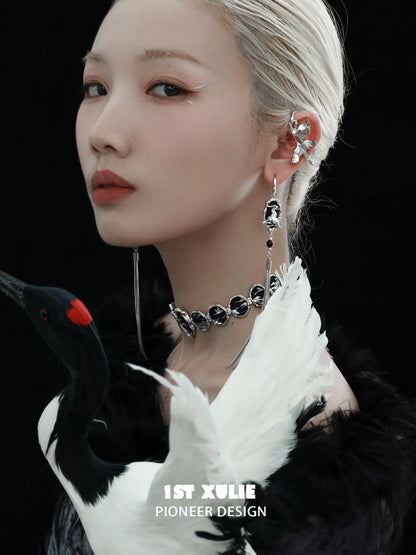 Model wearing Y2K crane earrings featuring a unique design and elegant silver details