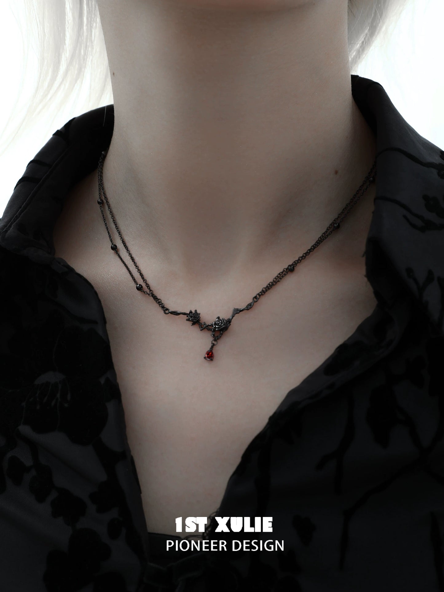 Y2K goth rose necklace featuring intricate black flowers and a red gemstone for a unique gothic style