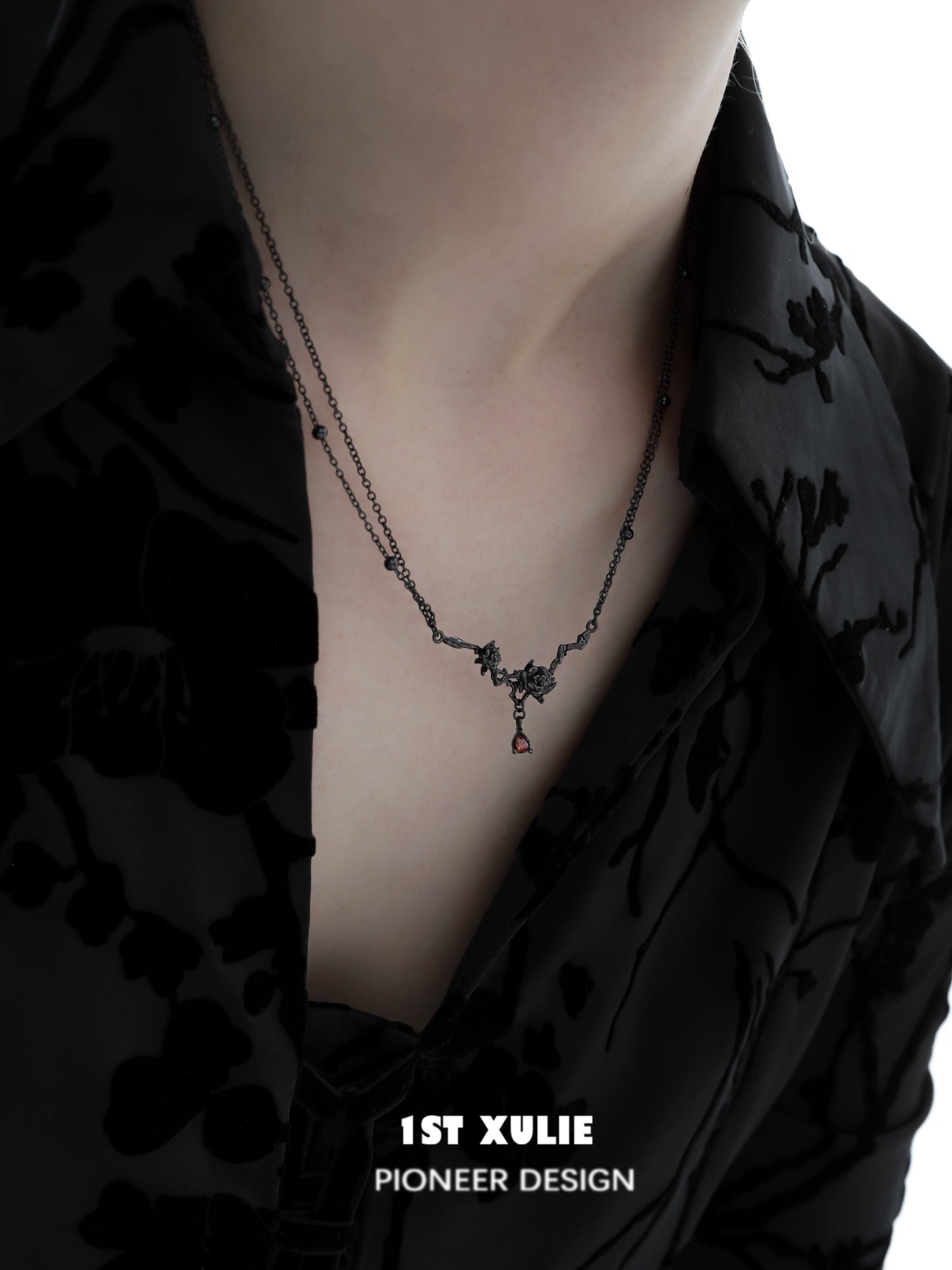 Y2K goth rose necklace displayed on a model wearing a black floral shirt