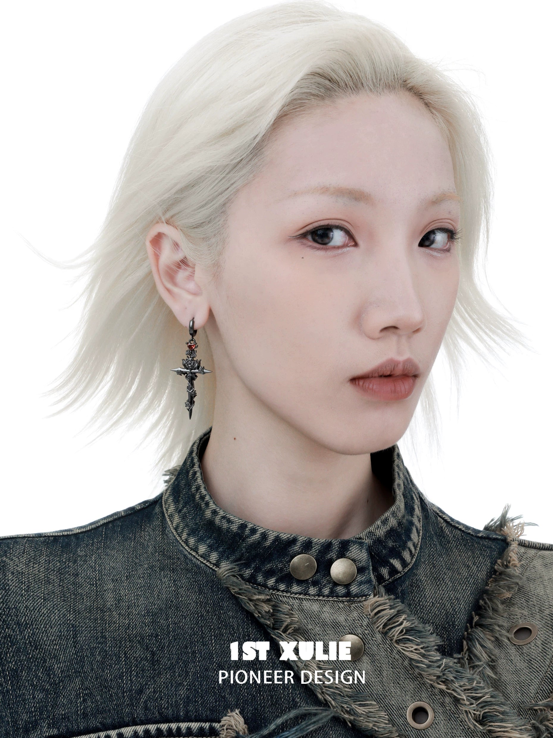 Model wearing Y2K gothic cross earrings with a punk-inspired outfit and platinum hair