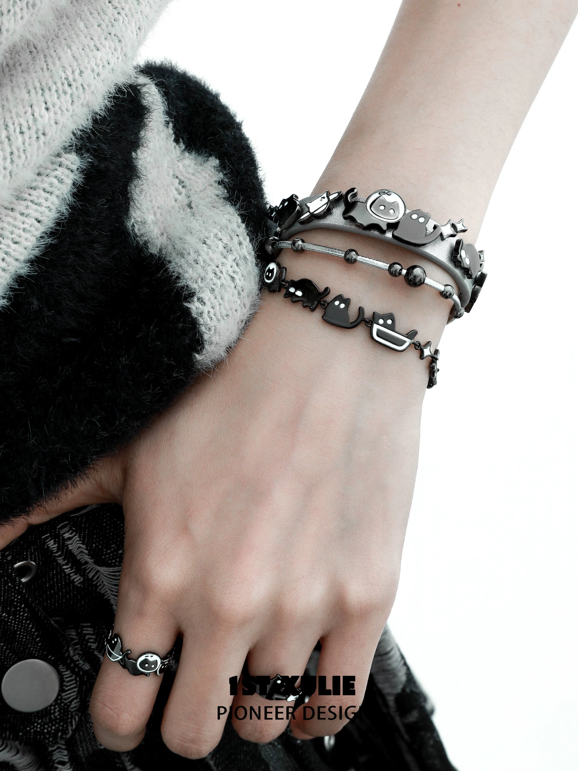 Y2K kitty leather bracelet featuring playful cat charms and stylish black design.