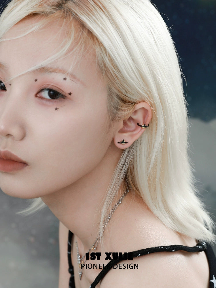 Model showcasing Y2K lonely dreamer earrings with a stylish minimalist design and a cosmic background