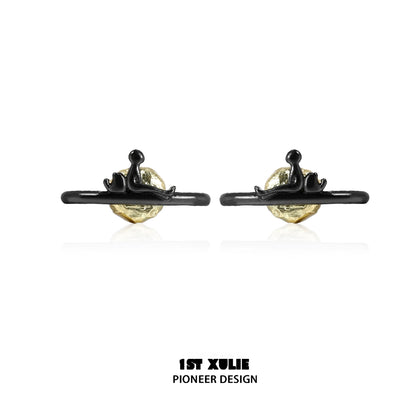 Y2K lonely dreamer earrings featuring a unique design with a gold and black finish
