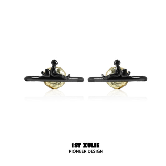 Y2K lonely dreamer earrings featuring a unique design with a gold and black finish