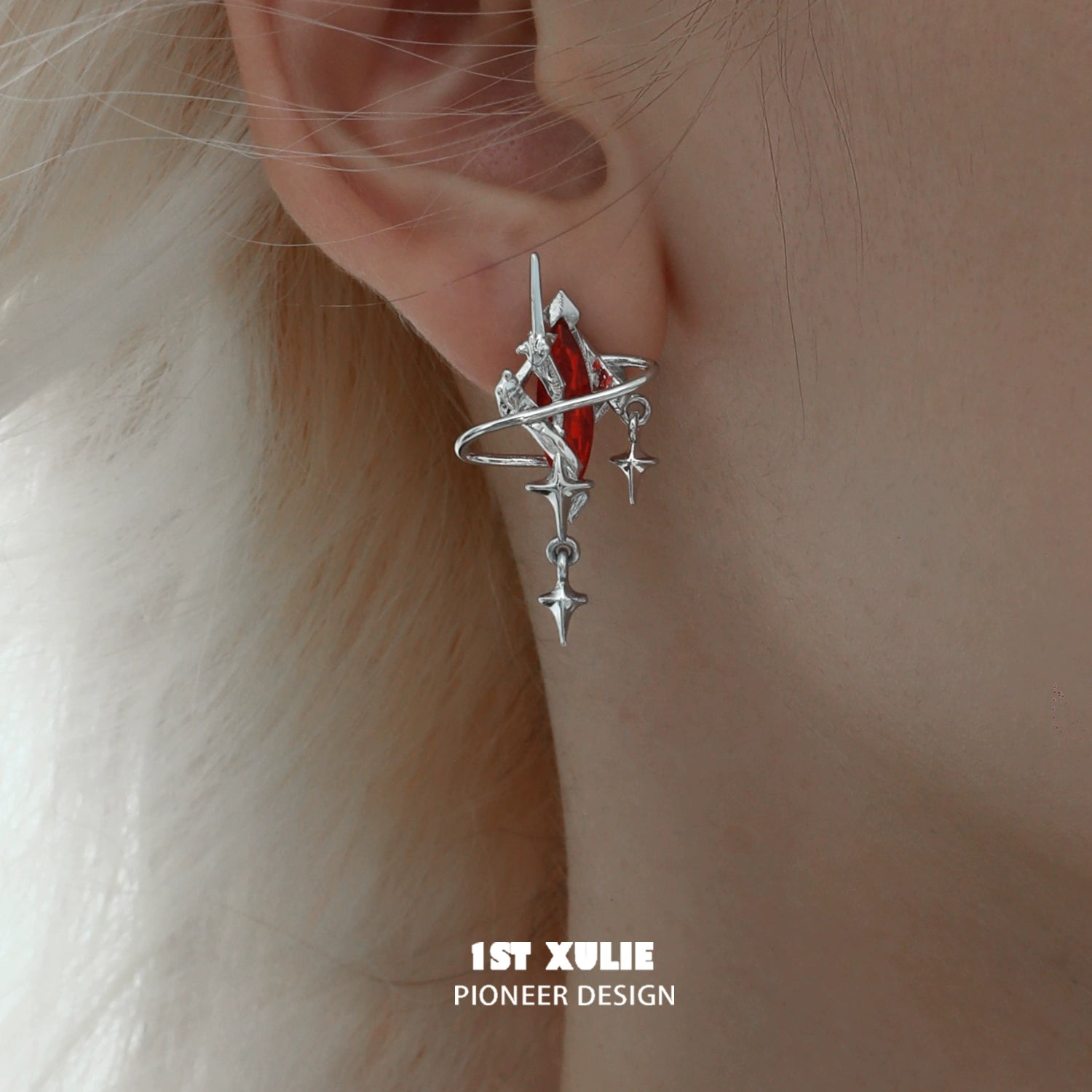 Silver Y2K mystic earrings with celestial design and red accents for a trendy statement