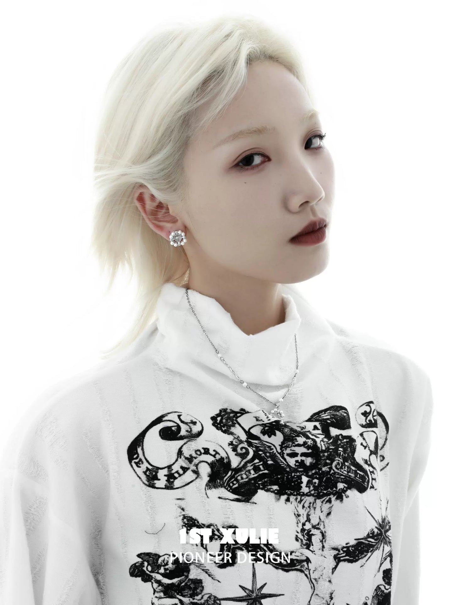 Y2K pearl earrings displayed on a model with a stylish white outfit and bold makeup