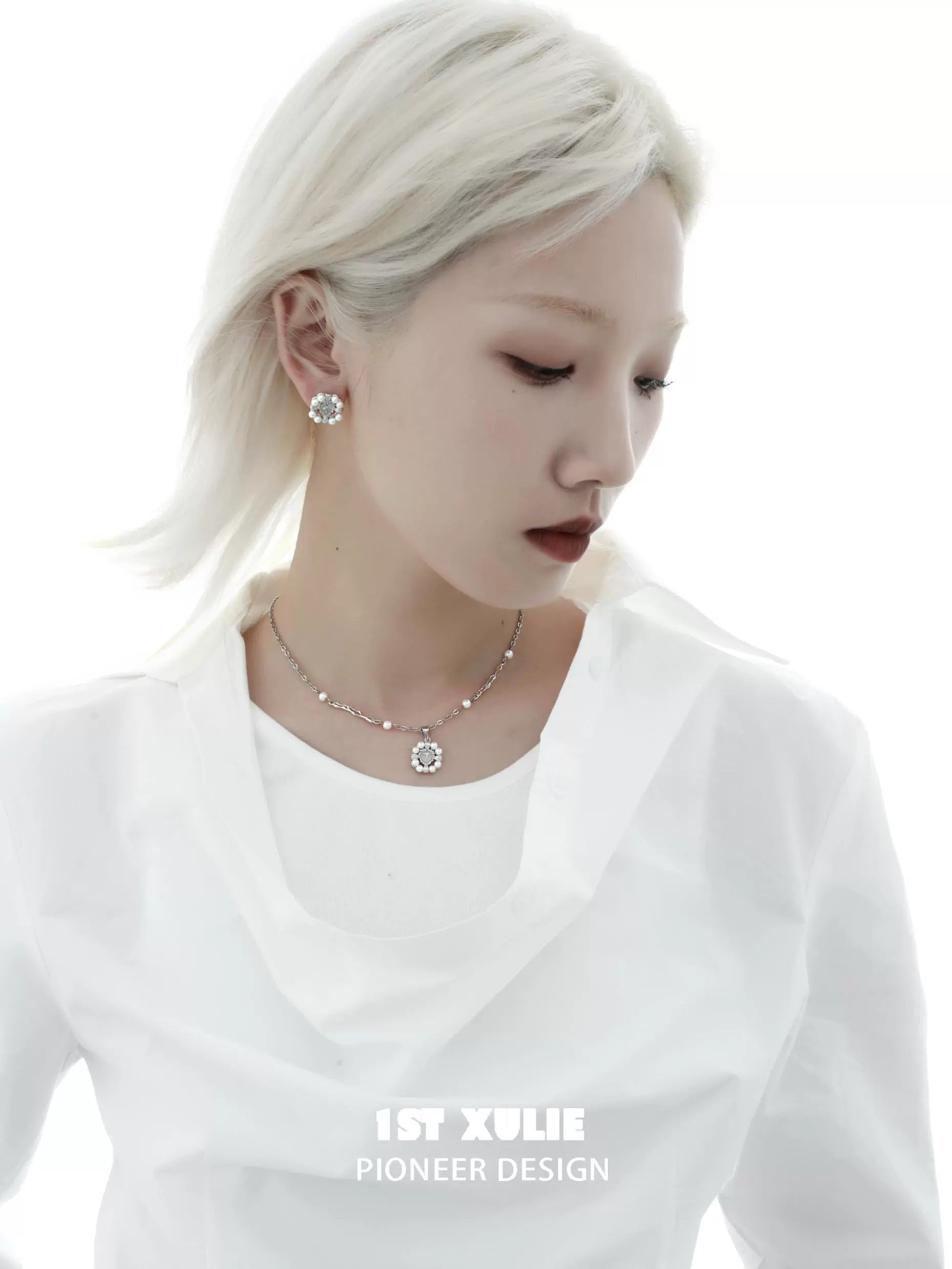 Y2K pearl earrings styled elegantly with a white blouse for a modern sophisticated look
