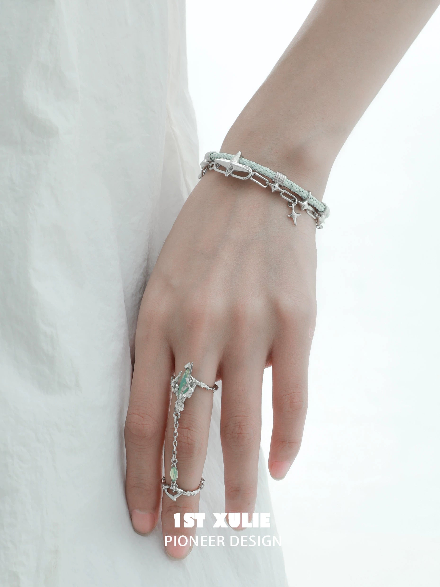 Trendy Y2K punk silver ring displayed on a hand with a silver bracelet for fashion enthusiasts