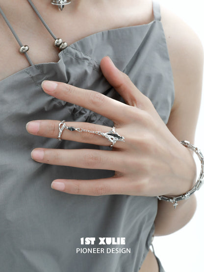 Y2K punk silver ring featuring a unique design displayed on a model's hand