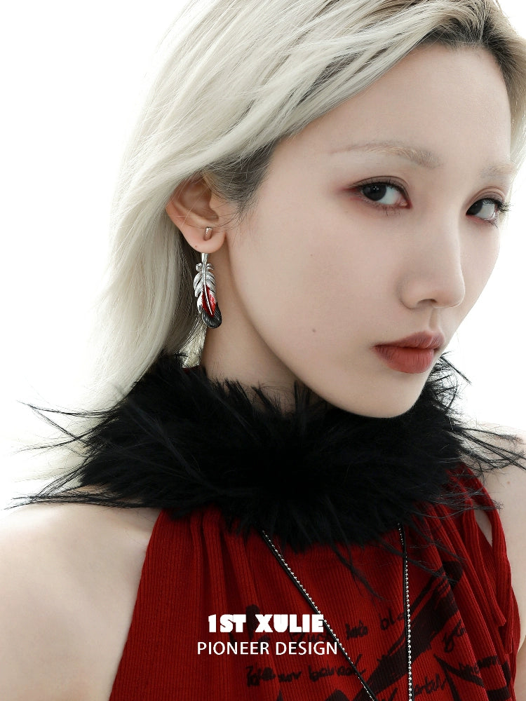 Stylish 1STXULIE Y2K red feather earrings with an elegant design worn by a model in a chic outfit