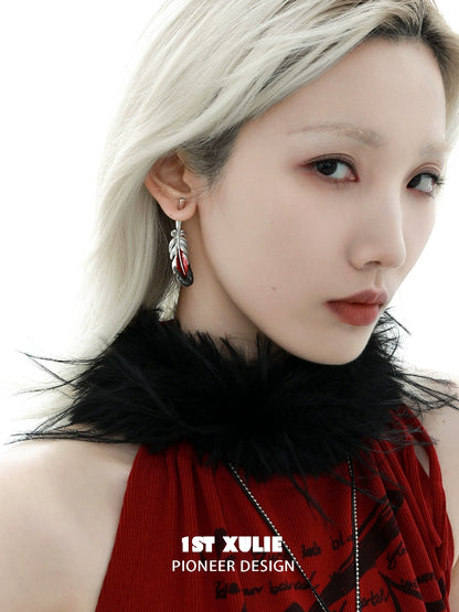 Stylish 1STXULIE Y2K red feather earrings with an elegant design worn by a model in a chic outfit