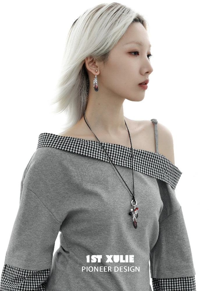Y2K red feather earrings showcased on a model wearing a stylish gray off-shoulder top
