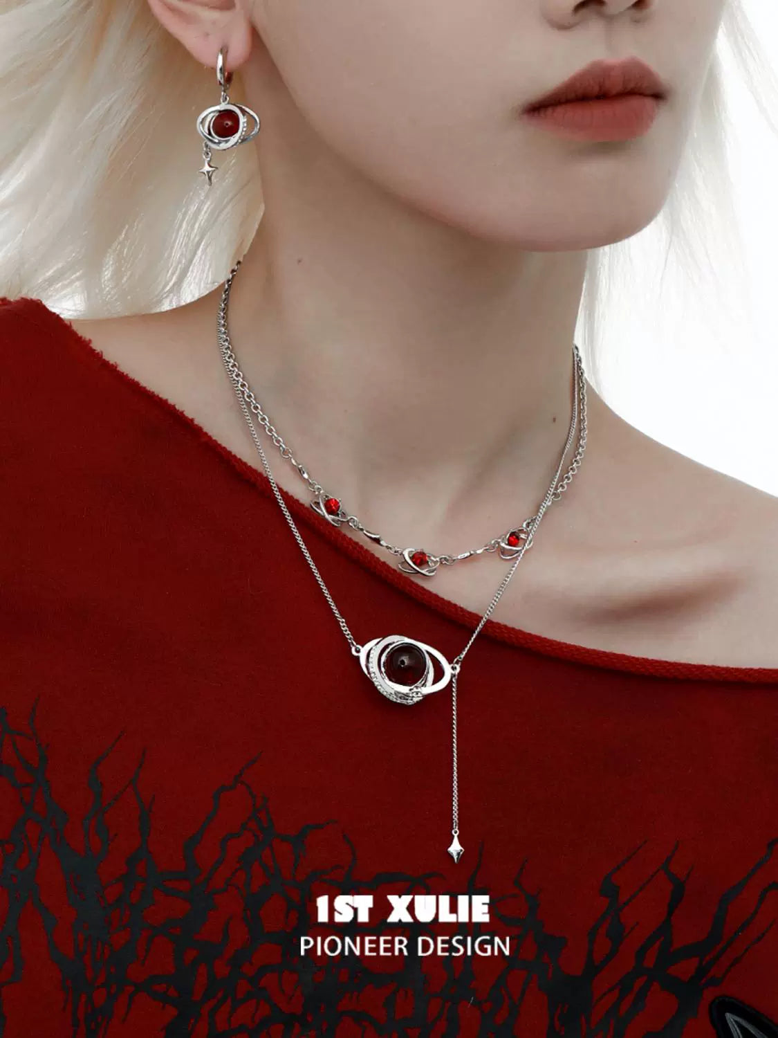 Y2K red planet earrings paired with silver jewelry for a trendy look