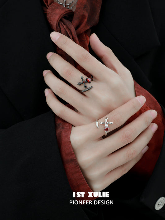 Y2K silver love ring displayed on a model's hand alongside other stylish rings