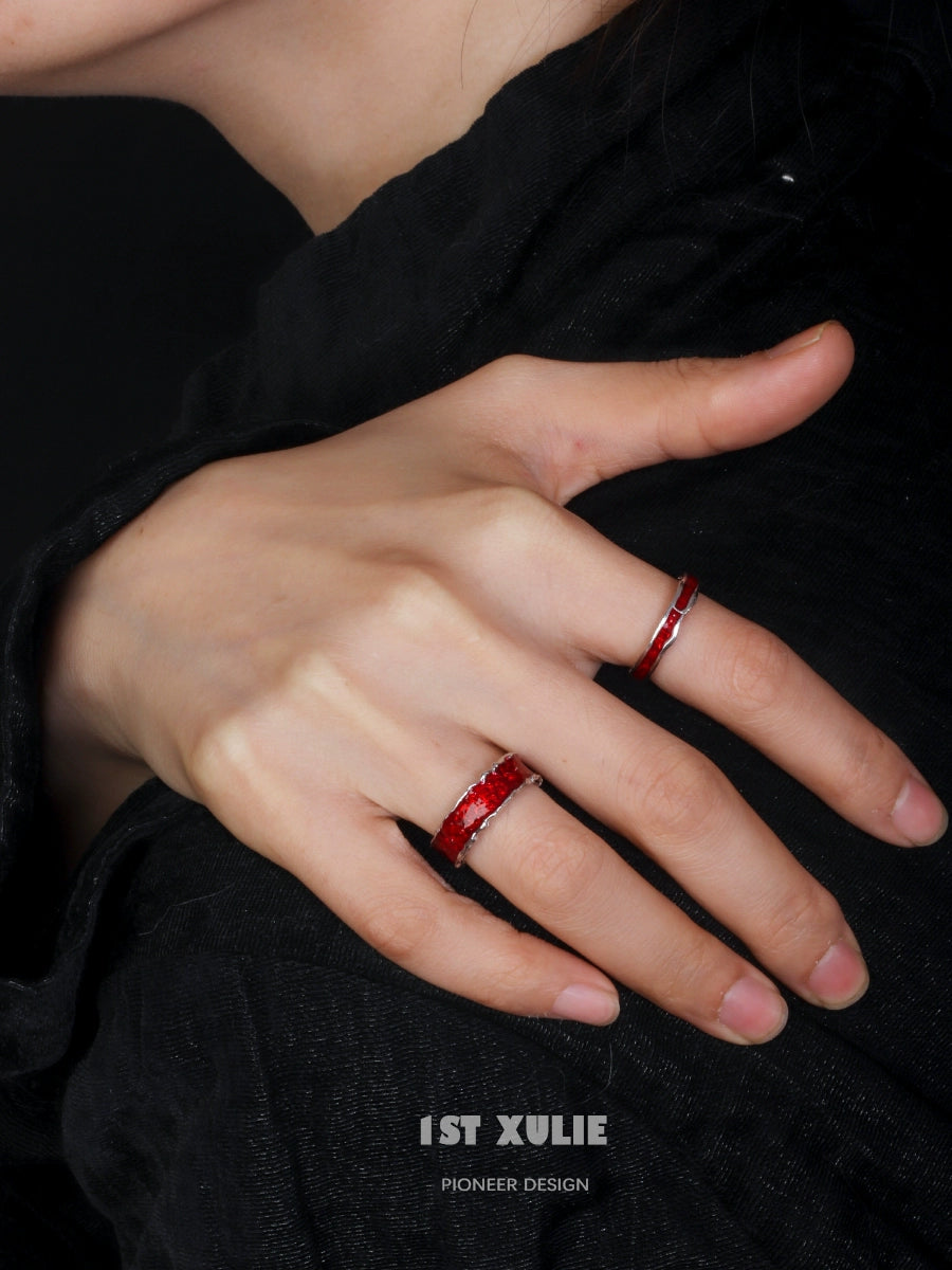 Two stylish Y2K silver rings displayed on a model's hand for a trendy look