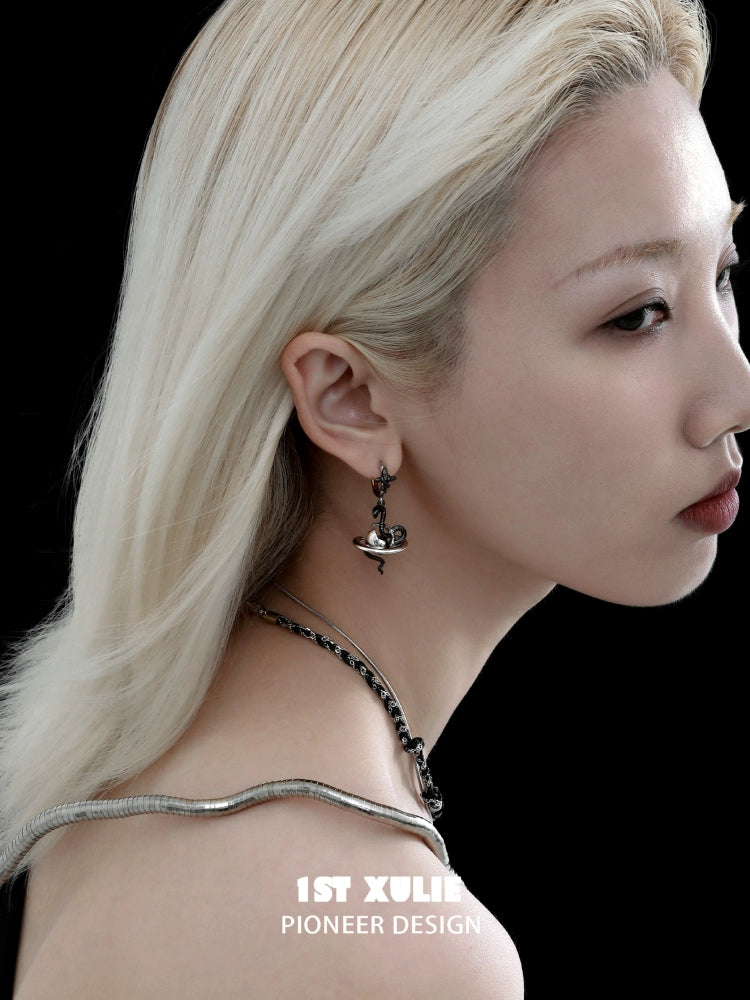Model wearing y2k snake earrings in a stylish design, showcasing unique fashion accessories